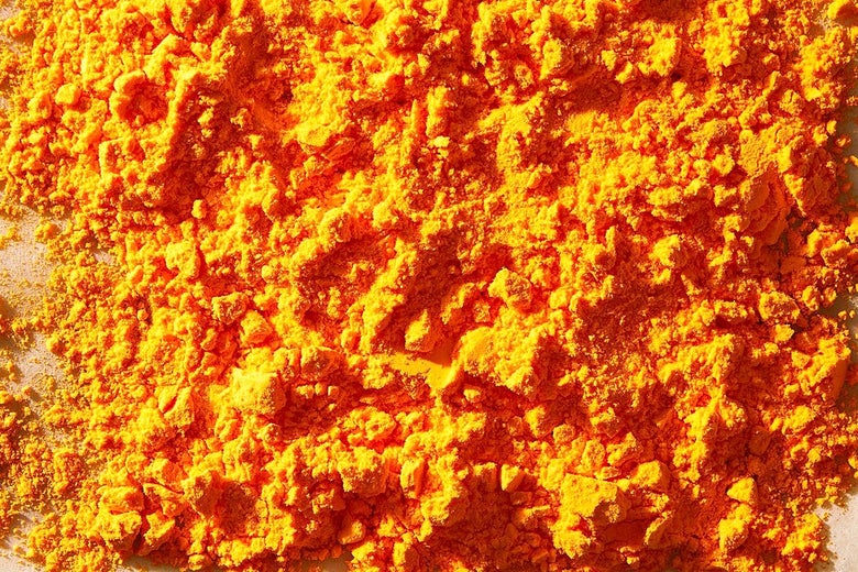 Bright orange cheese powder close up