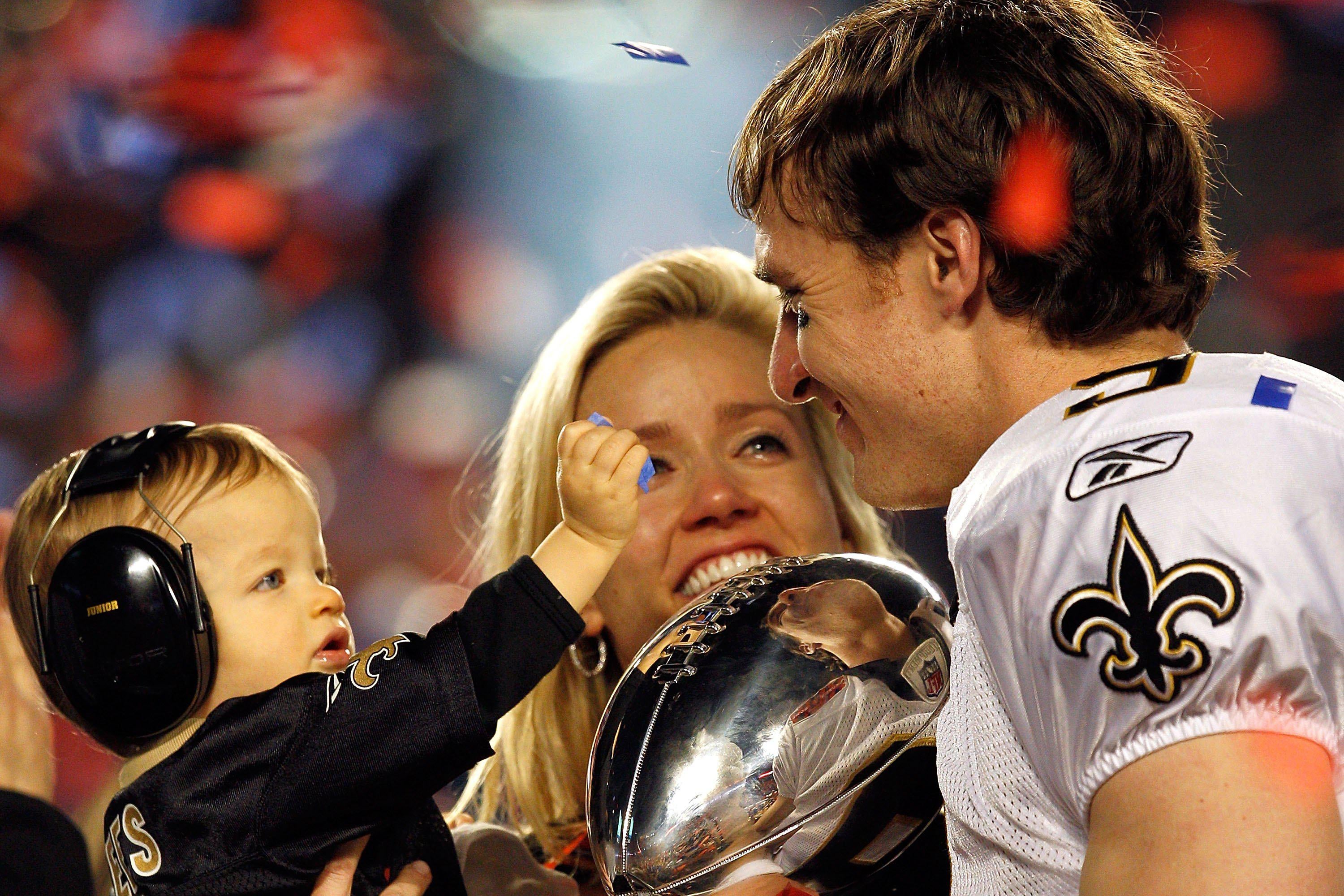 MIAMI GARDENS, FL - FEBRUARY 07:  Drew Brees #9 of the New Orleans Saints celebrates with his son Baylen Brees and wife Brittany Brees after defeating the Indianapolis Colts during Super Bowl XLIV on February 7, 2010 at Sun Life Stadium in Miami Gardens, Florida.  (Photo by Jonathan Daniel/Getty Images)