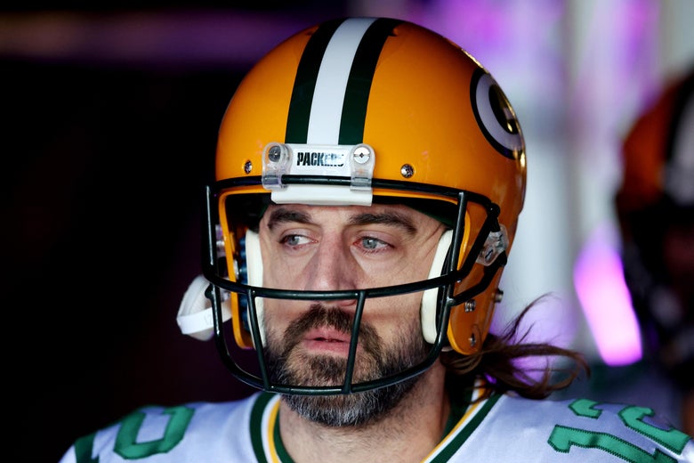 Rodgers in his helmet and frowning