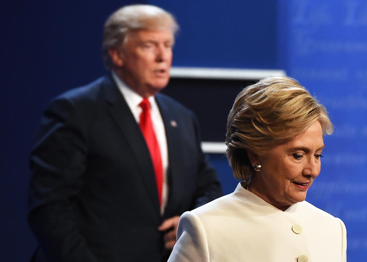 Democratic nominee Hillary Clinton and Republican nominee Donald Trump walk off the stage after the final presidential debate at the Thomas & Mack Center on the campus of the University of Las Vegas in Las Vegas, Nevada on October 19, 2016.