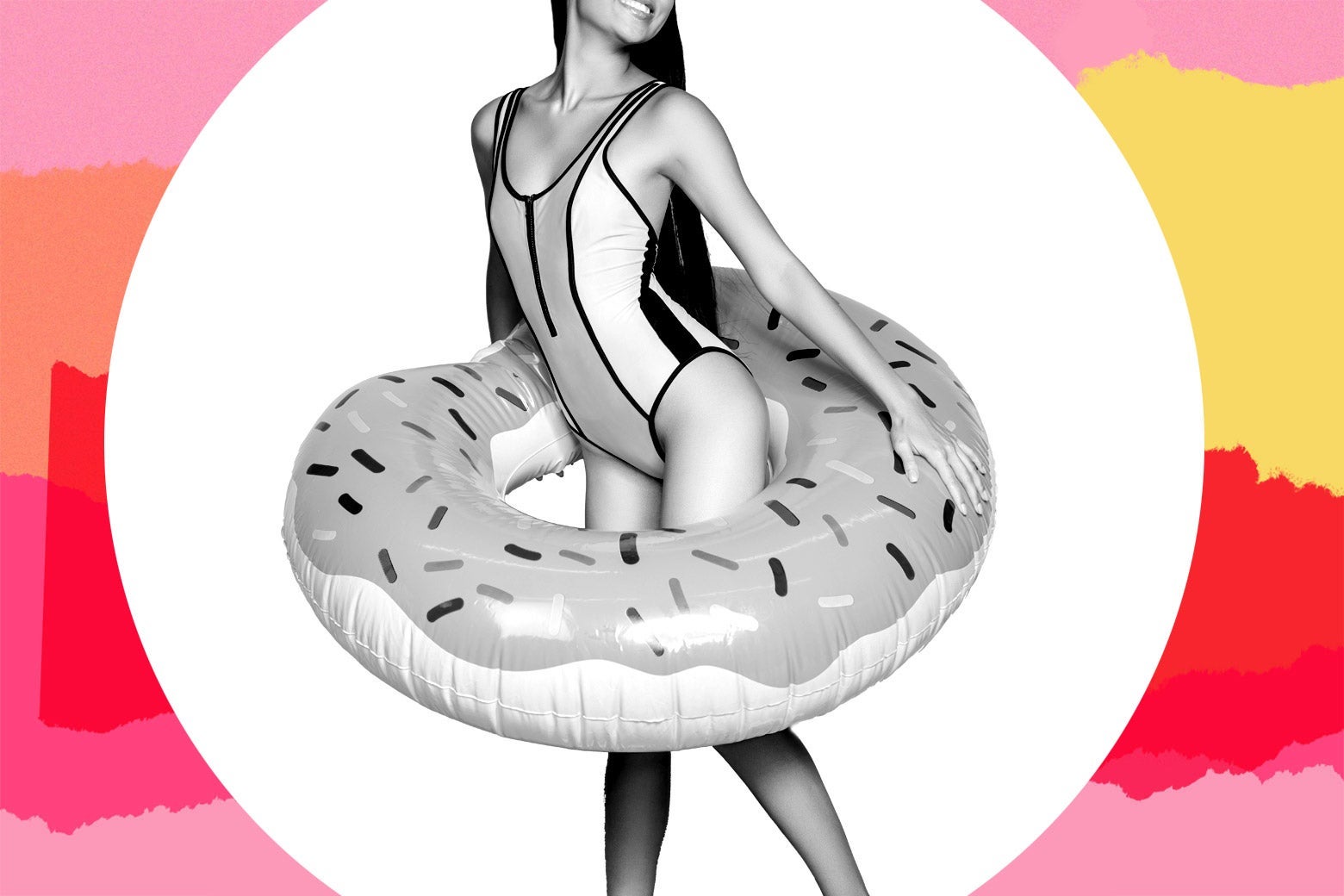 A woman in a swimsuit holding an inflatable donut around her waist.