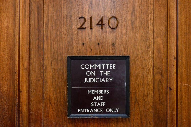 A sign on a closed wooden door reads COMMITTEE ON THE JUDICIARY: MEMBERS AND STAFF ENTRANCE ONLY.