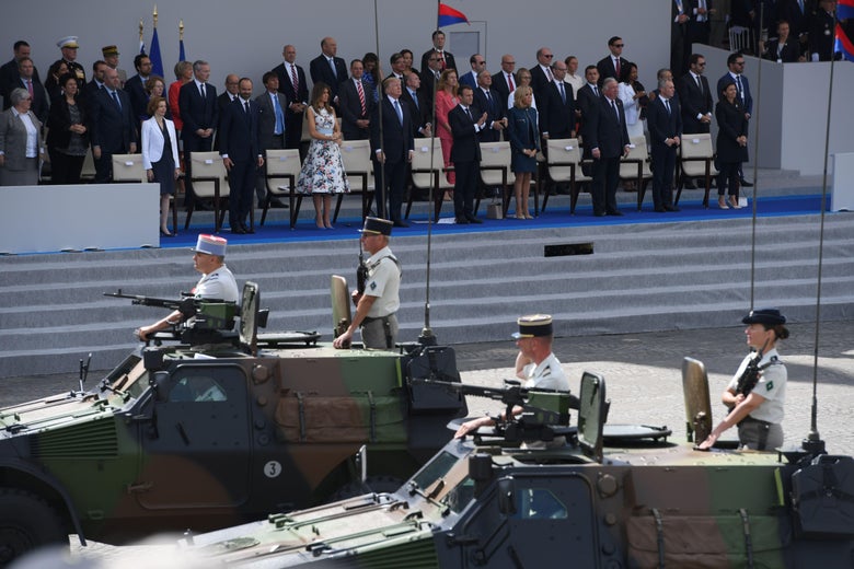 (FromL) French Defence Minister Florence Parly, French Prime Minister Edouard Philippe, US President Donald Trump and his wife First Lady Melania Trump, French President Emmanuel Macron and his wife Brigitte Macron, Senate President Gerard Larcher, the President of the French National Assembly Francois de Rugy and the Mayor of Paris Anne Hidalgo watch as members of the 3rd Division (3e Division) parade during the annual Bastille Day military parade on the Champs-Elysees avenue in Paris on July 14, 2017.
The parade on Paris's Champs-Elysees will commemorate the centenary of the US entering WWI and will feature horses, helicopters, planes and troops. / AFP PHOTO / CHRISTOPHE ARCHAMBAULT        (Photo credit should read CHRISTOPHE ARCHAMBAULT/AFP/Getty Images)