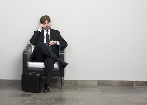 Man with briefcase waiting before a job interview