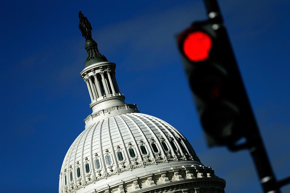 A traffic light is seen in front of the United States Capitol building Sept. 29, 2013