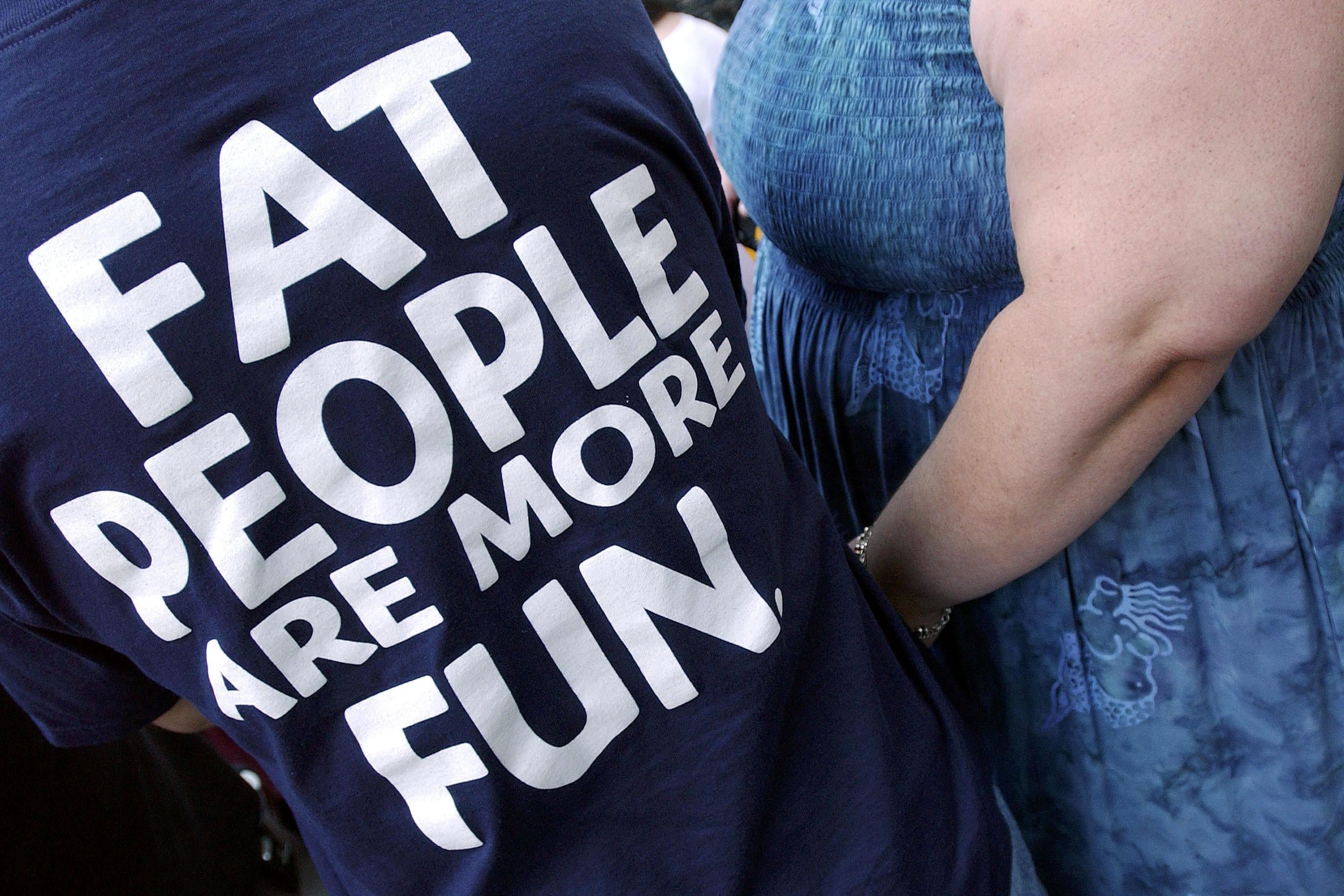 A person wears a 'Fat People are More Fun' tee-shirt during a National Association to Advance Fat Acceptance (NAAFA) rally 
