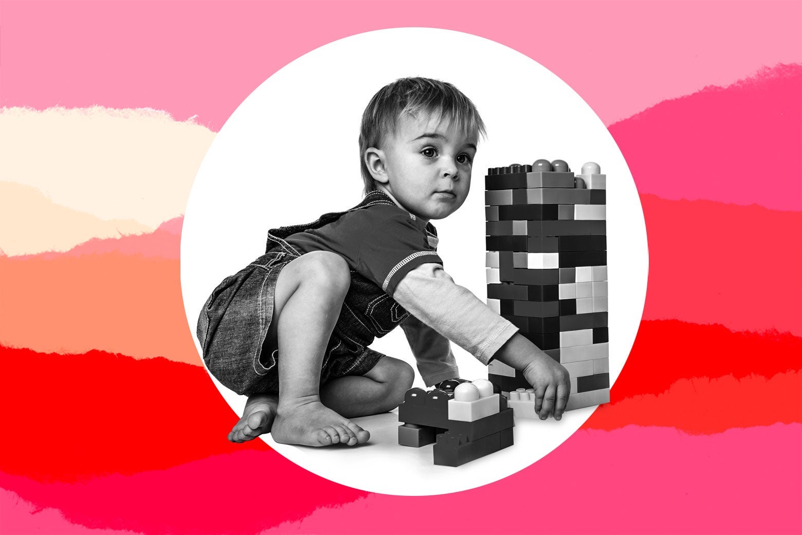 A toddler plays with building blocks.