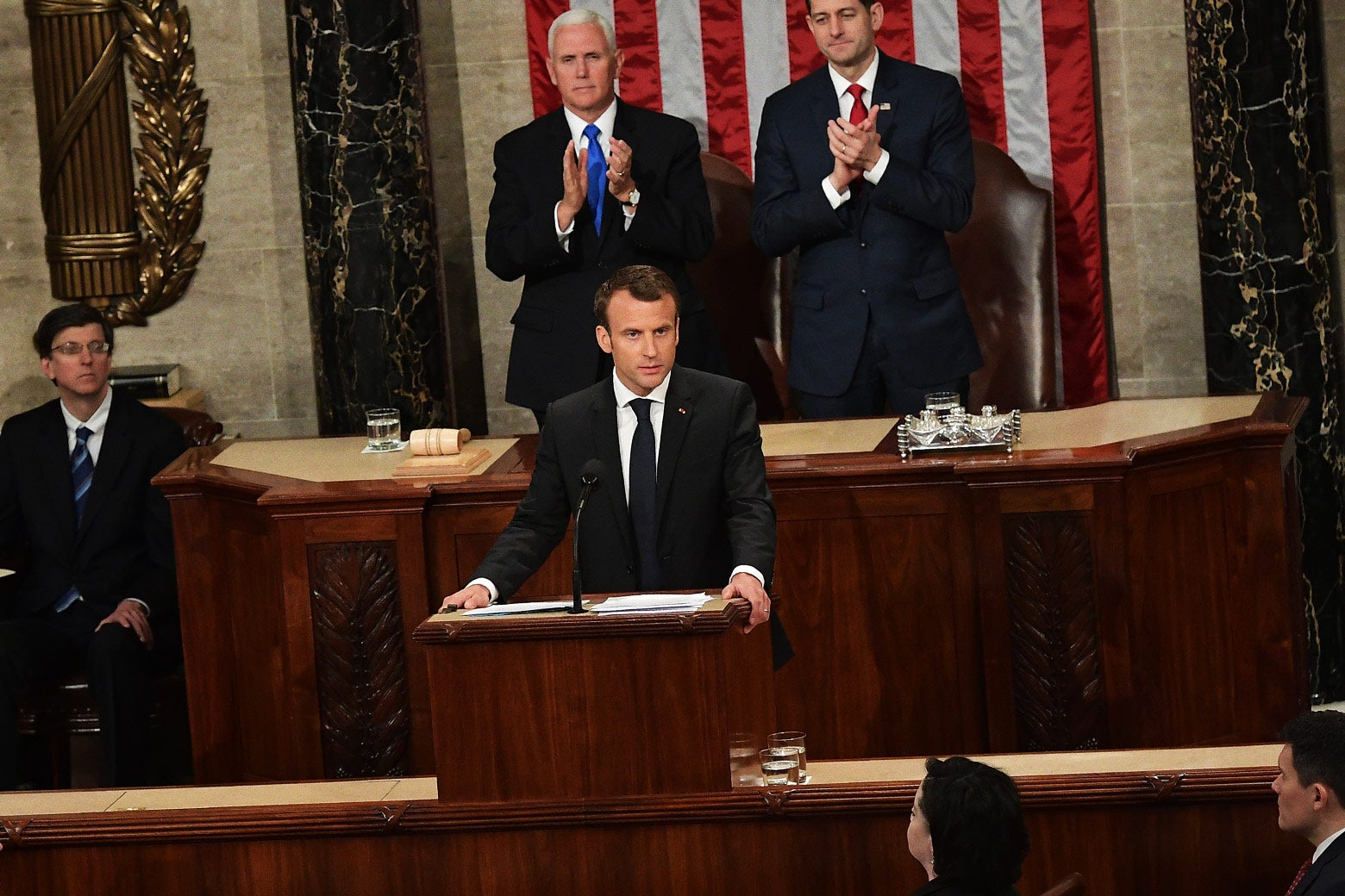 House Speaker Paul Ryan and Vice President Mike Pence applaud after France's President Emmanuel Macron addresses Congress on Wednesday in Washington.