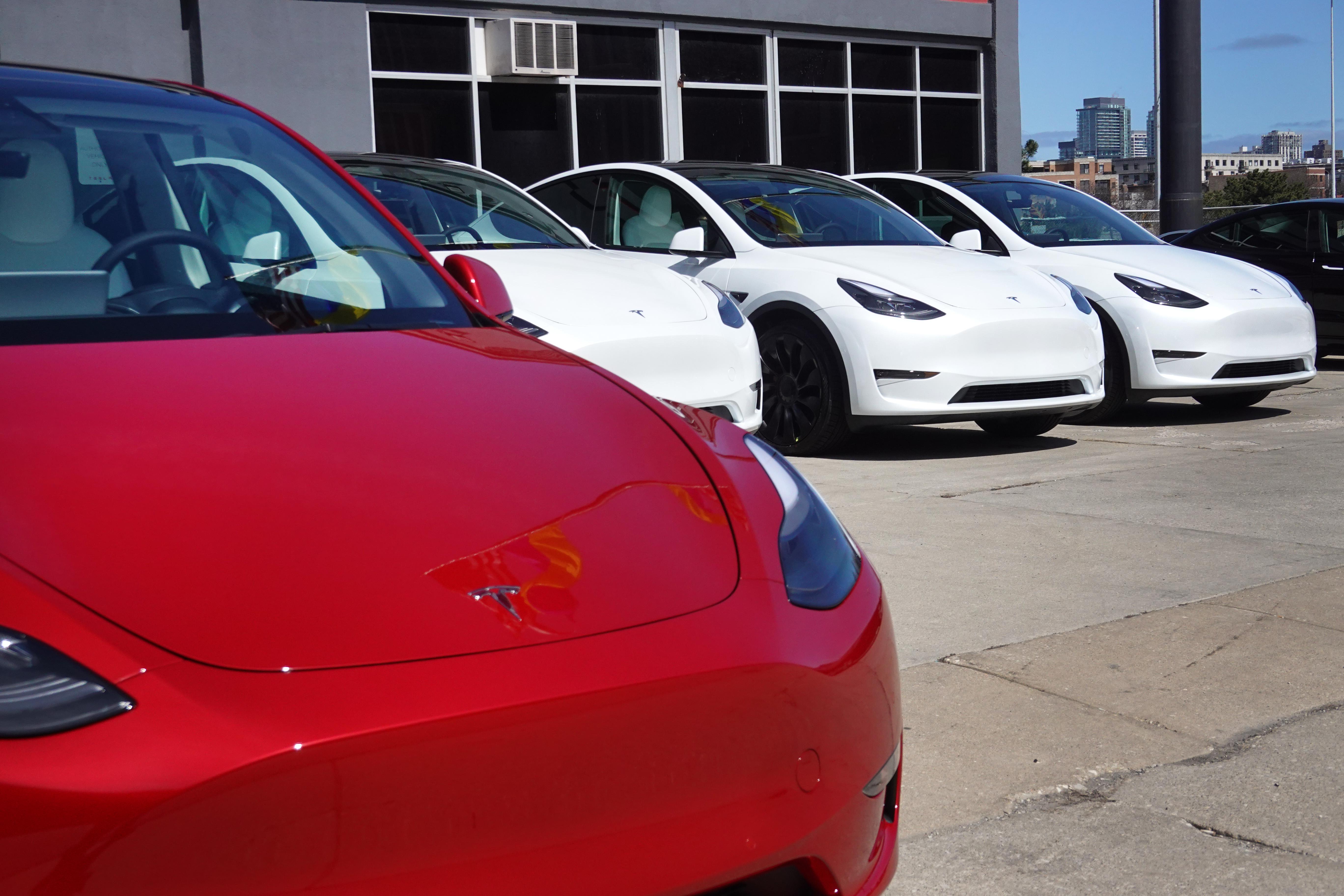 Tesla cars seen in a dealership lot