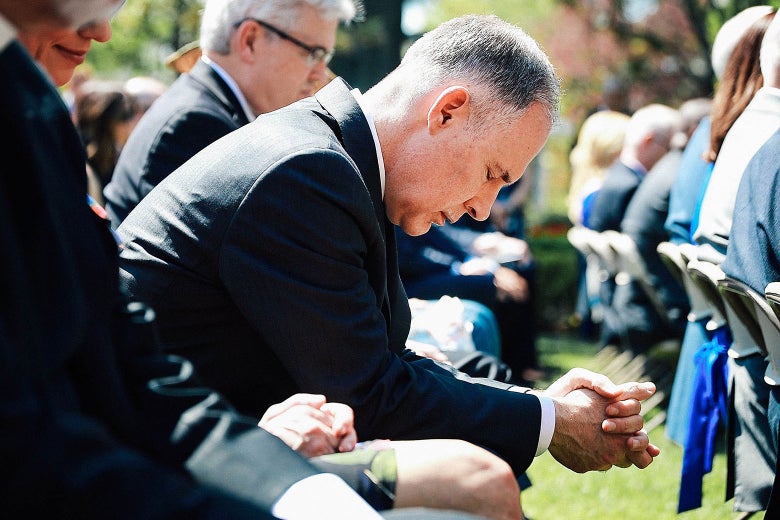 Environmental Protection Agency Administrator Scott Pruitt bows his head in prayer during an event to mark the National Day of Prayer on May 3 in Washington.