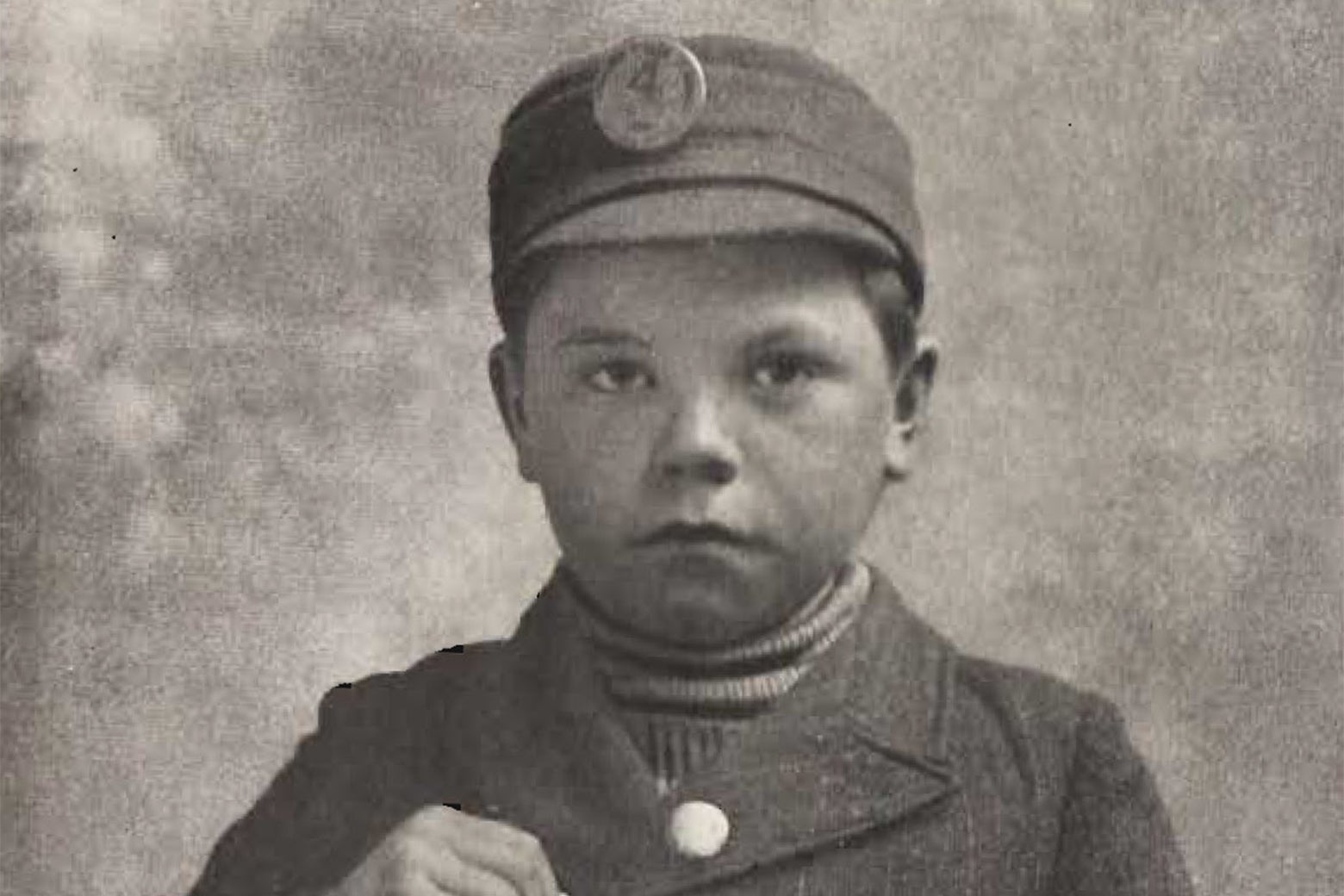 A little kid in a work uniform, as pictured in a biography of Henry Demarest Lloyd.