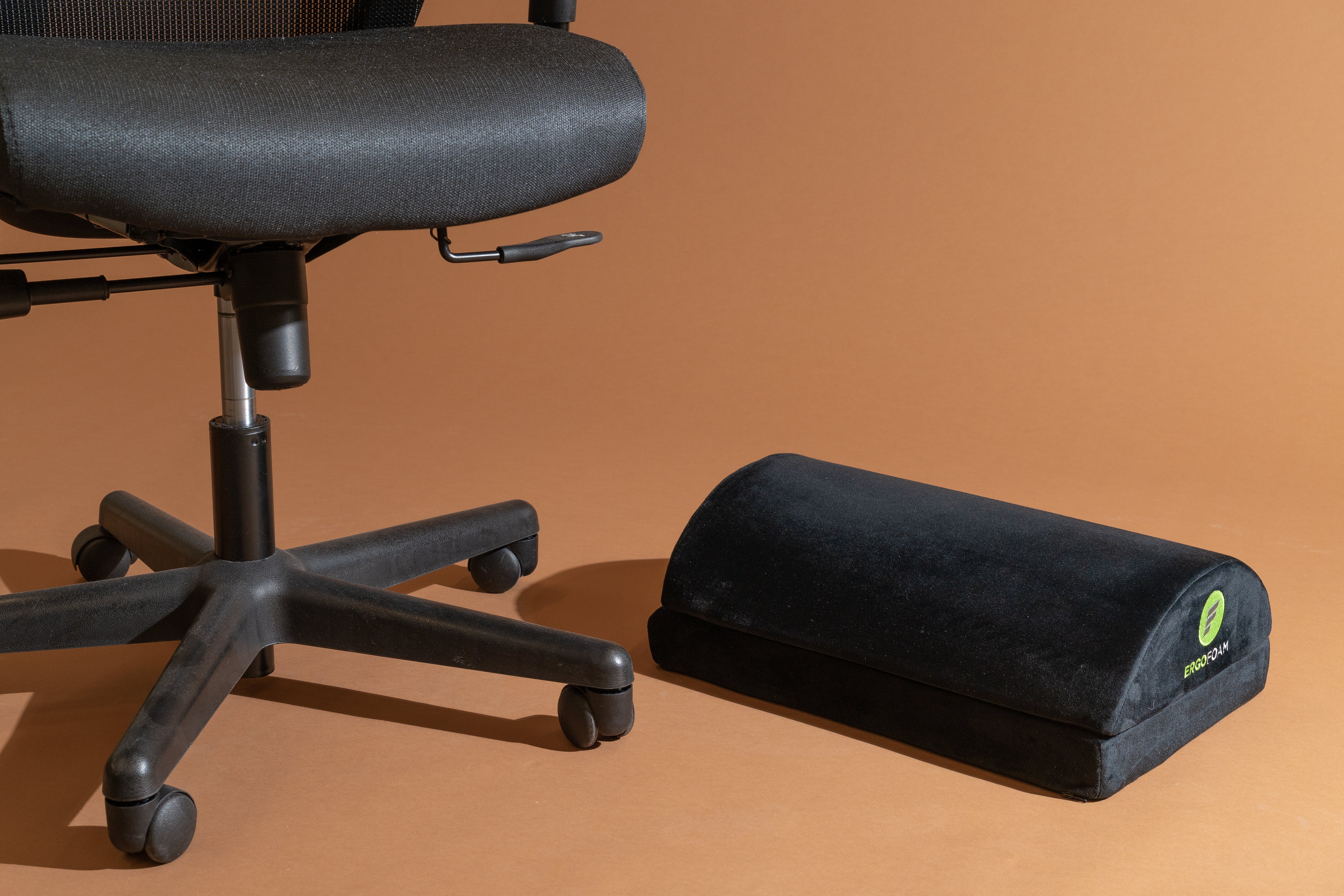 An office chair with the ErgoFoam Adjustable Foot Rest