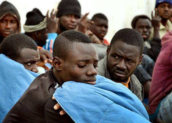 Illegal migrants after they were rescued by fishermen when their,Illegal migrants after they were rescued by fishermen when their boat got into difficulties while trying to sail from Libya to Europe. 