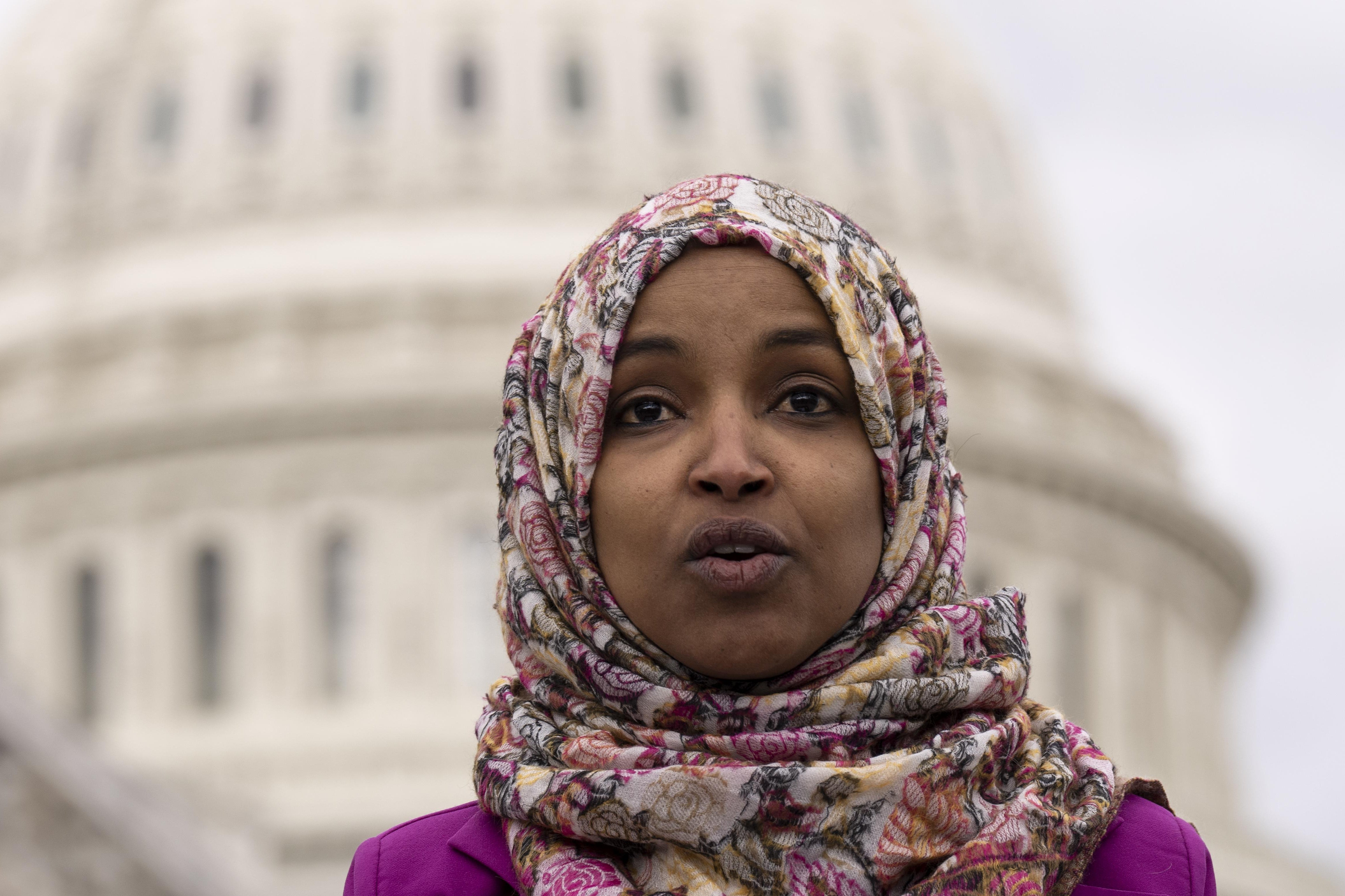 Omar speaking with the Capitol dome behind her