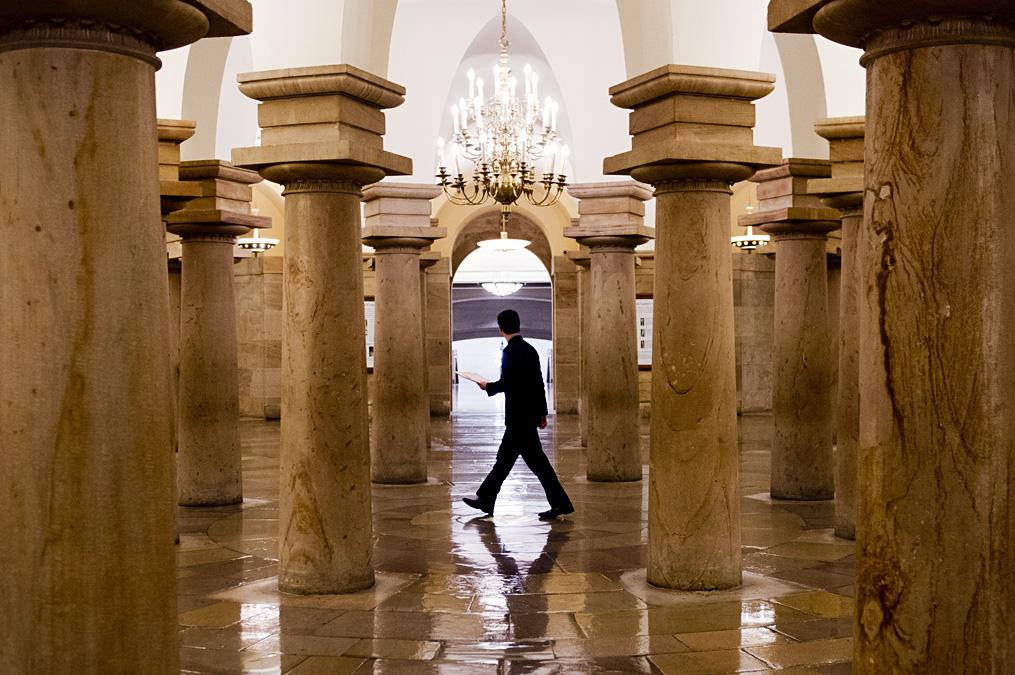 A US Senate employee walks through the Capitol Crypt, Sept. 25, 2013.