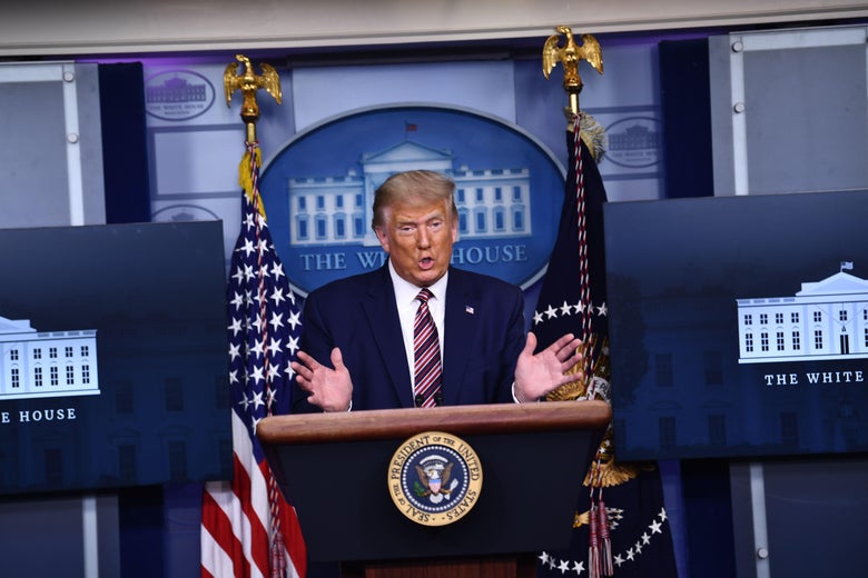 Donald Trump speaks at a podium in the White House briefing room.