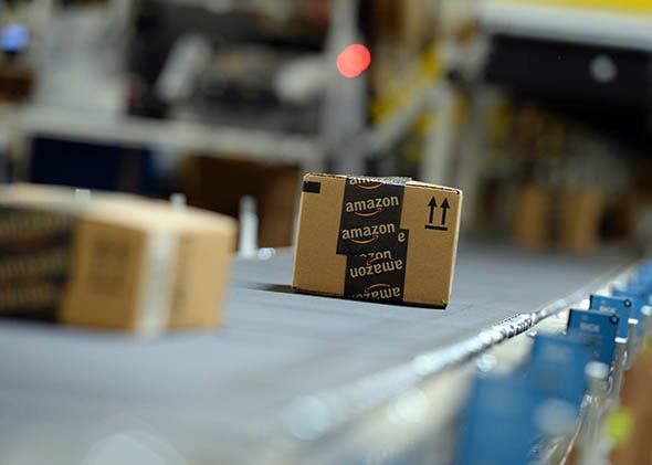 Shipping orders go by on a conveyor belt at Amazon's San Bernardino Fulfillment Center October 29, 2013 in San Bernardino, California. 