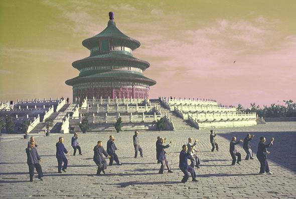 Men doing tai chi in front of the Hall of Prayer for Good Harvests at the Temple of Heaven complex in Beijing, China.