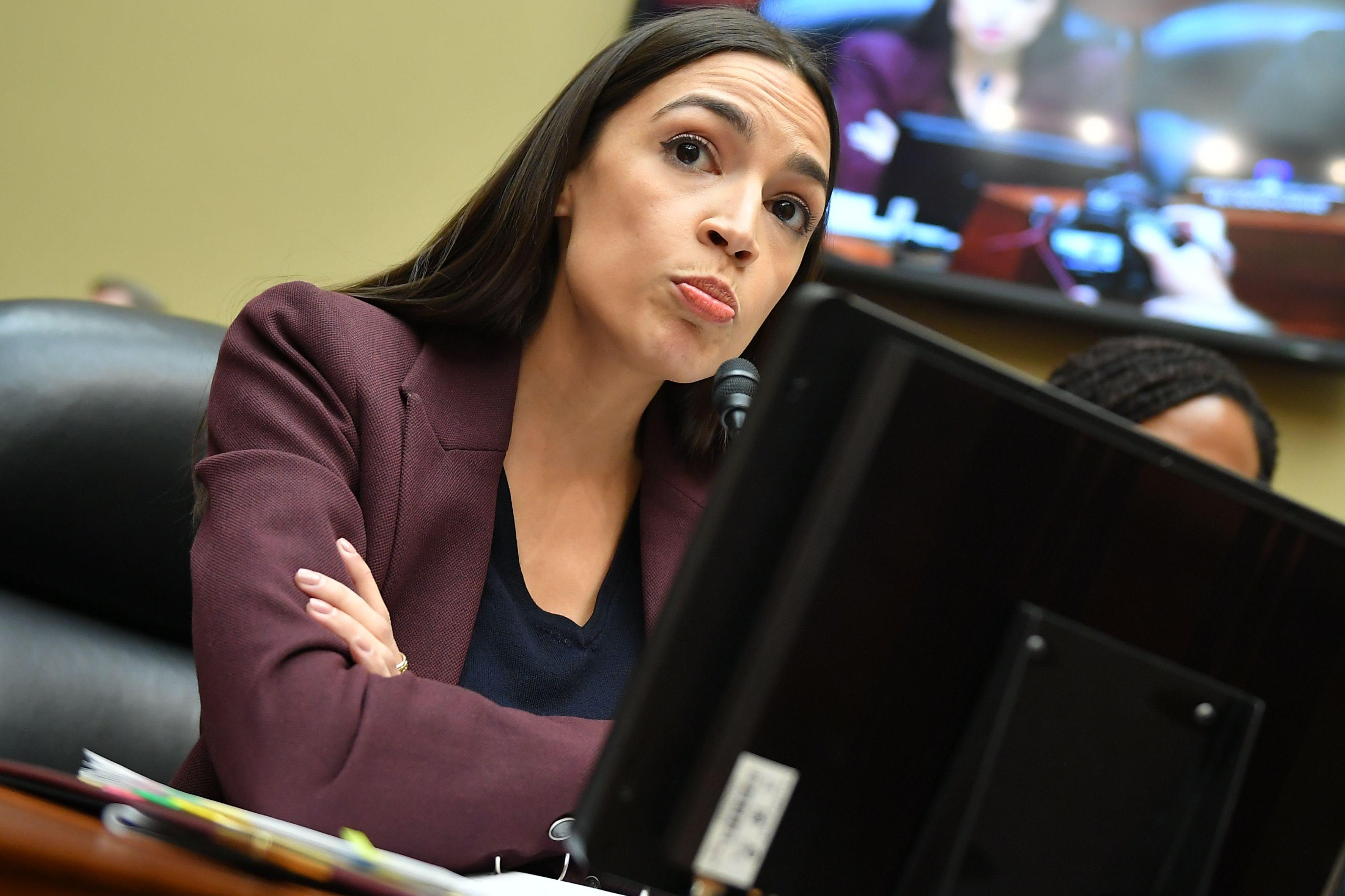 Rep. Alexandria Ocasio-Cortez, Democrat of New York, questions Michael Cohen, President Donald Trump's former personal attorney, as he testifies before the House Oversight and Reform Committee in the Rayburn House Office Building on Capitol Hill in Washington, D.C. on February 27, 2019.