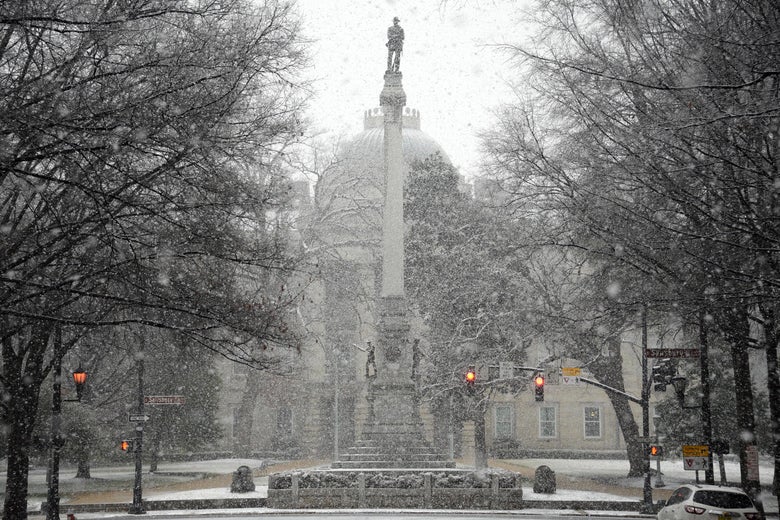 RALEIGH, NC - JANUARY 17: Snow falls on the Confederate Soldiers Monument at the State Capitol on January 17, 2018 in Raleigh, North Carolina. Governor Roy Cooper declared a State of Emergency yesterday ahead of the winter storm. (Photo by Lance King/Getty Images)