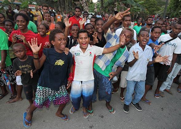 Locals cheer on Sept. 16, 2012, in Honiara, Guadalcanal Island in the Solomons.