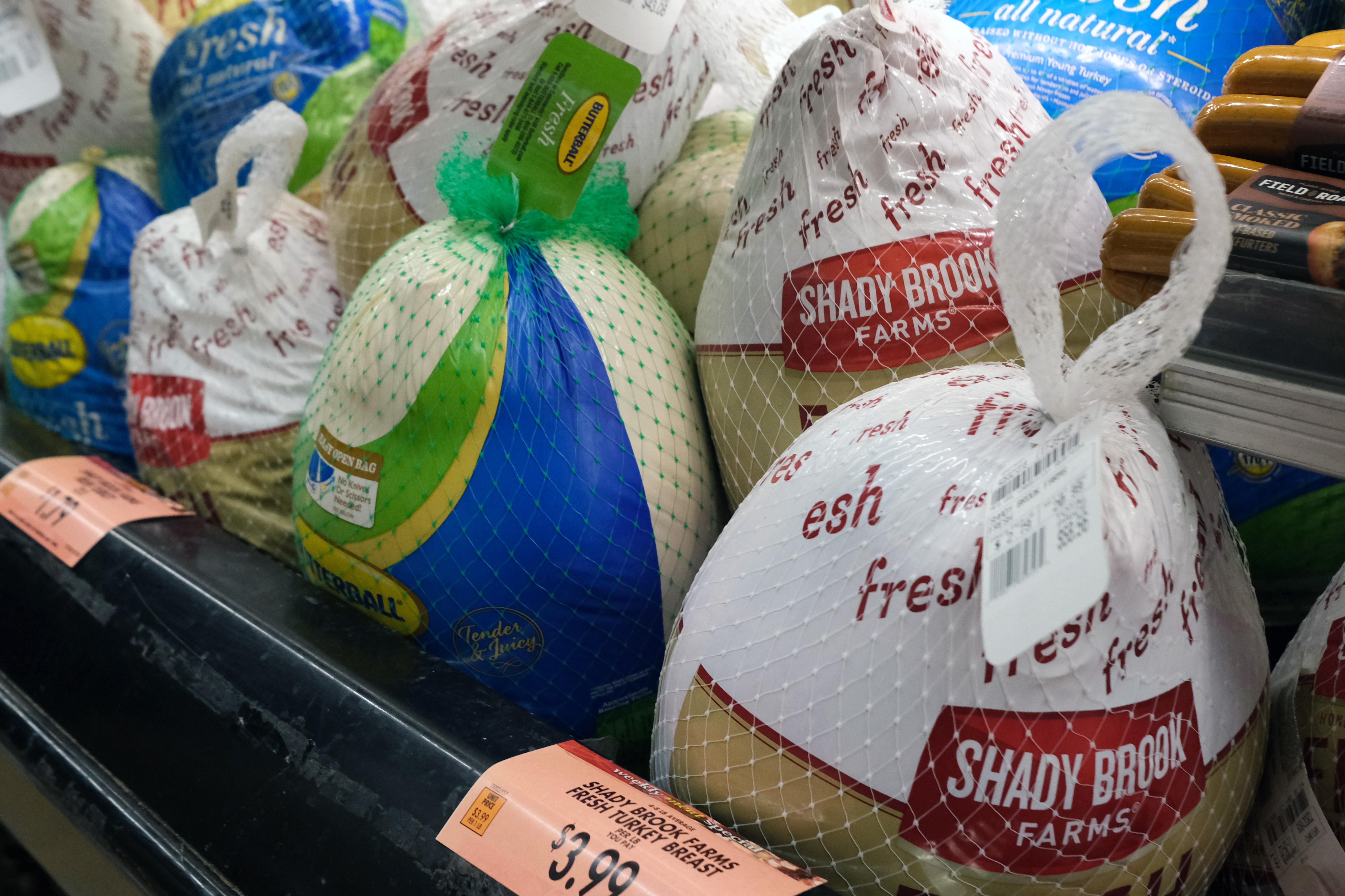 Frozen turkeys are displayed for sale inside a grocery store on November 14, 2022 in New York City. The price of turkeys, a staple for many Americans at Thanksgiving, is at record highs this year due to inflation and a rise in the price of feed among other cost issues.  (Photo by Spencer Platt/Getty Images)