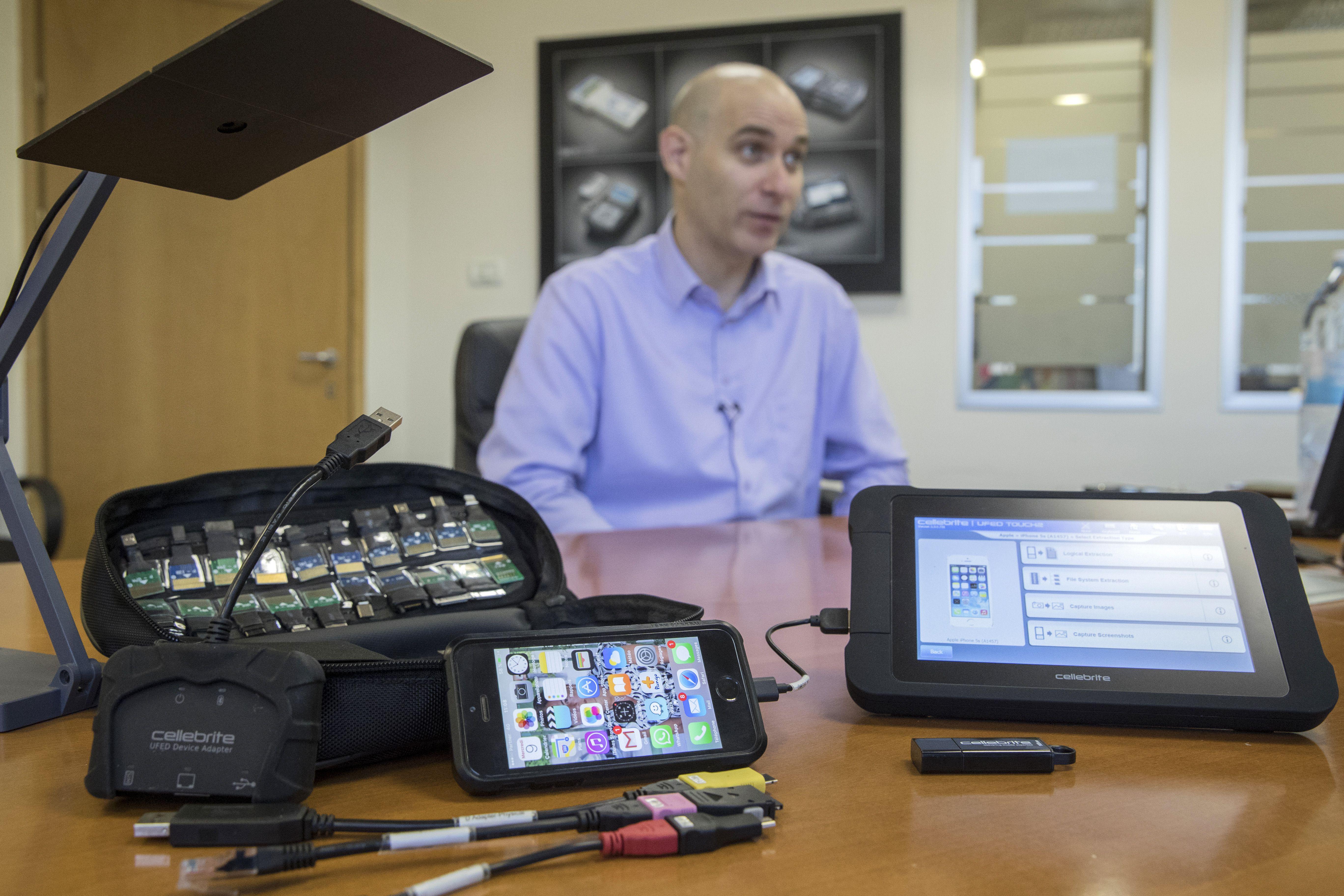 Leeor Ben-Peretz, the executive vice president of the Israeli firm Cellebrite’s technology, shows devices and explains the hacking technology developed by his company.