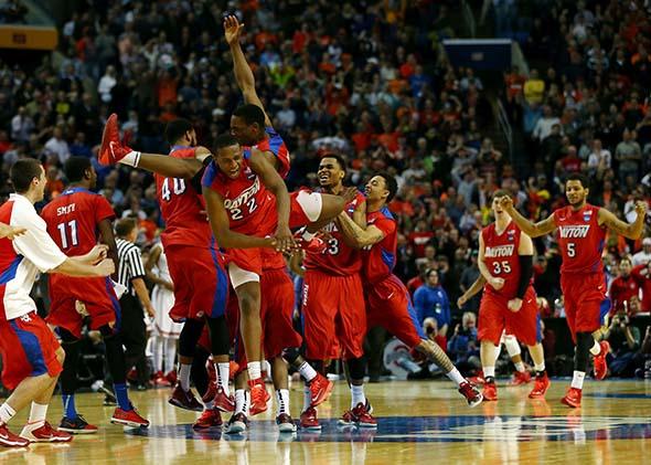 The Dayton Flyers celebrate after defeating the Ohio State Buckeyes.