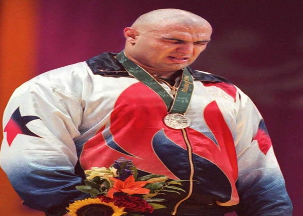 Matt Ghaffari of the US sobs on the podium after losing to Russian Alexander Karelin in the Olympic super heavyweight Greco-Roman wrestling final 23 July. Karelin took the gold.