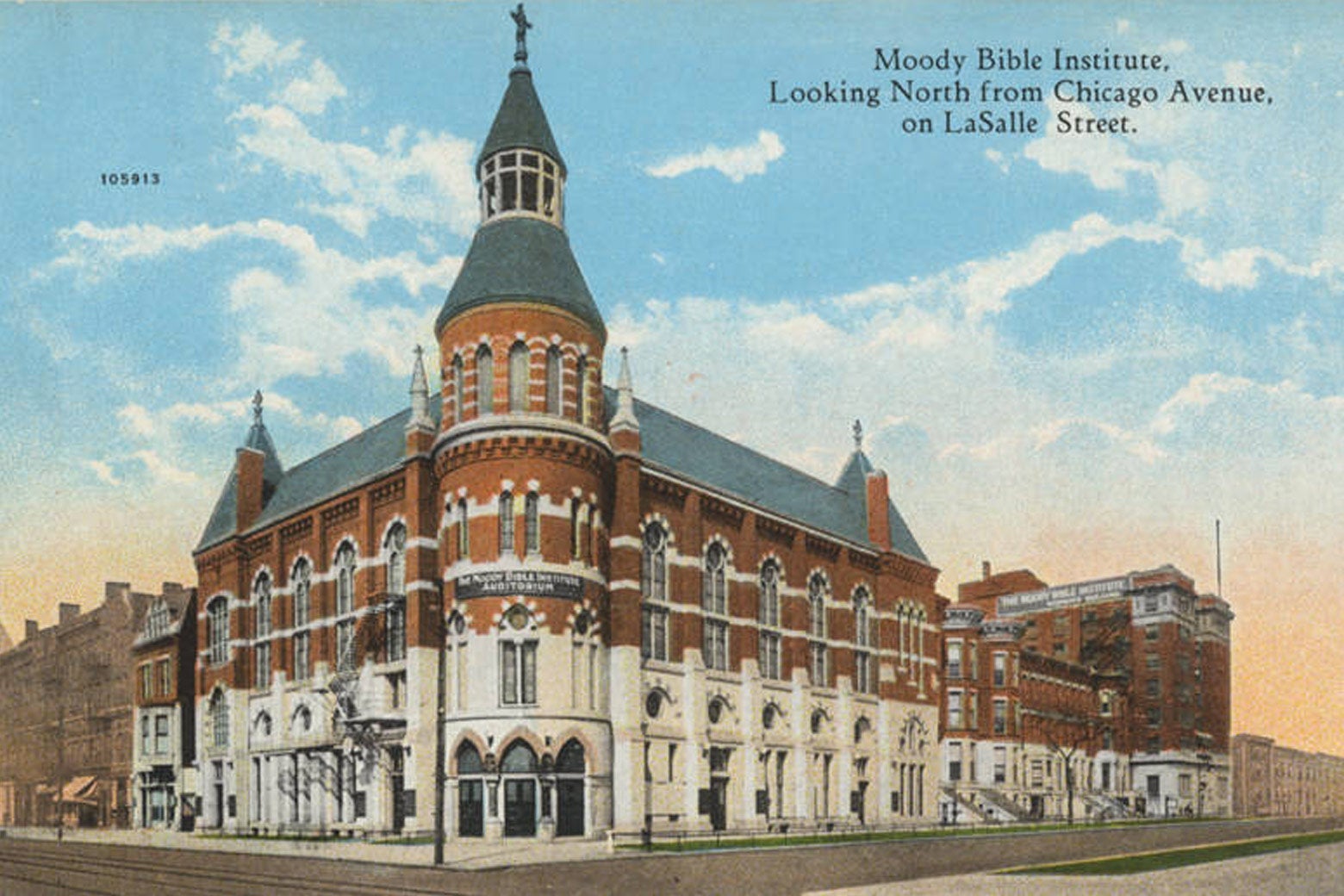 A postcard featuring an ornate corner brick building on Moody Bible’s campus.