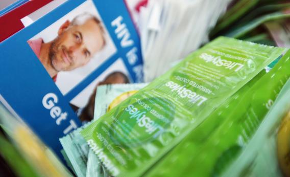 Free condoms and information are seen at a free HIV testing.