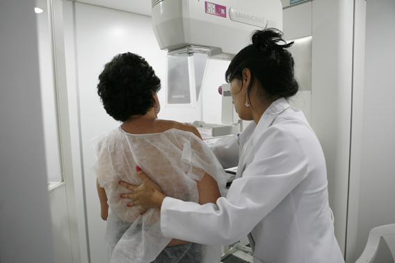 A woman undergoes a free mammogram inside Peru's first mobile unit for breast cancer detection.