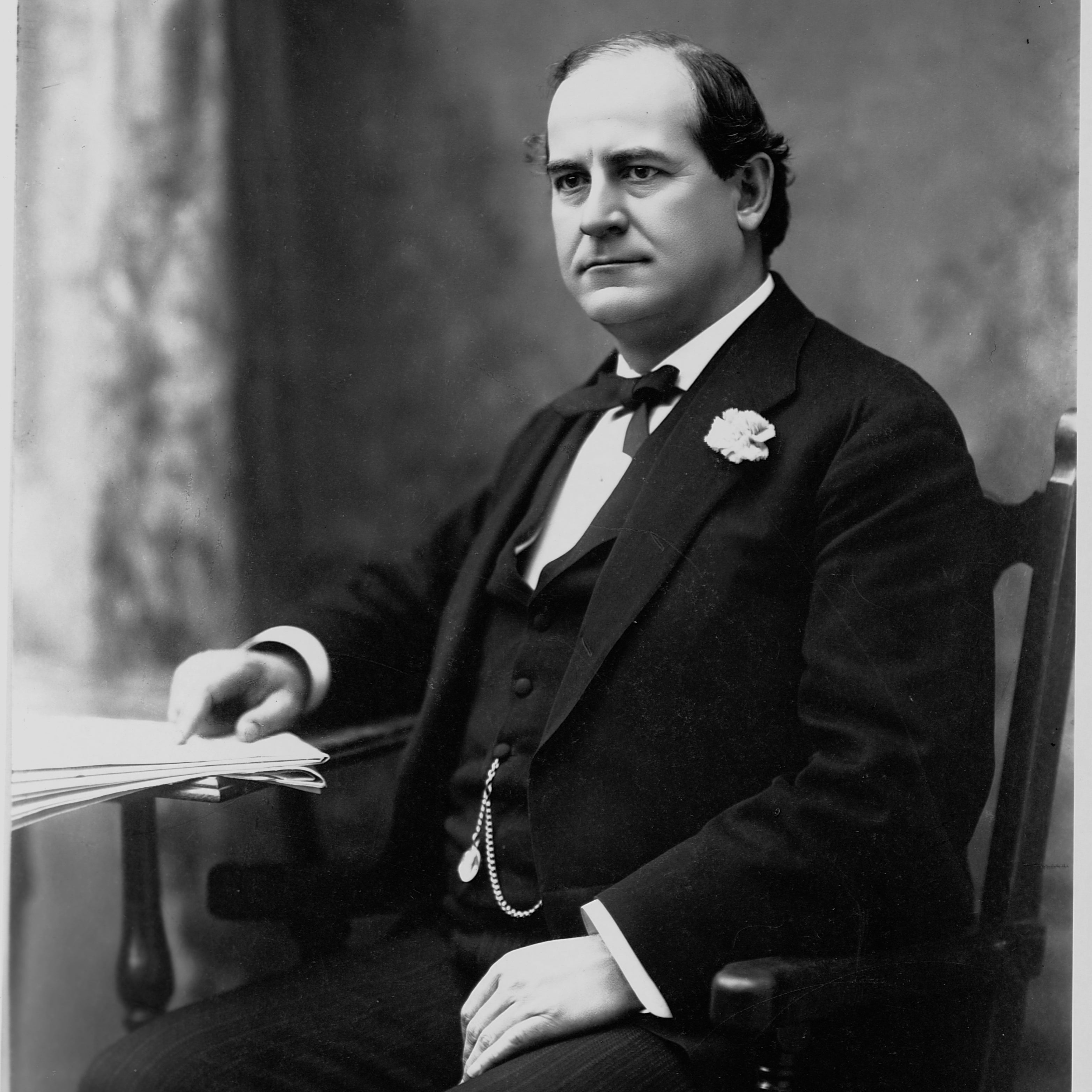 WJB seated in a three-piece suit with pocketwatch, looking to his right