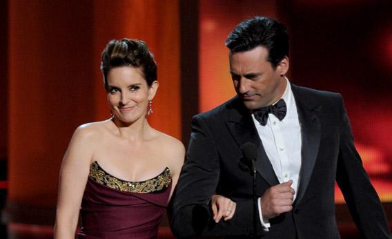 Actors Tina Fey and Jon Hamm speak onstage during the 64th Annual Emmy Awards on Sunday in Los Angeles, California.