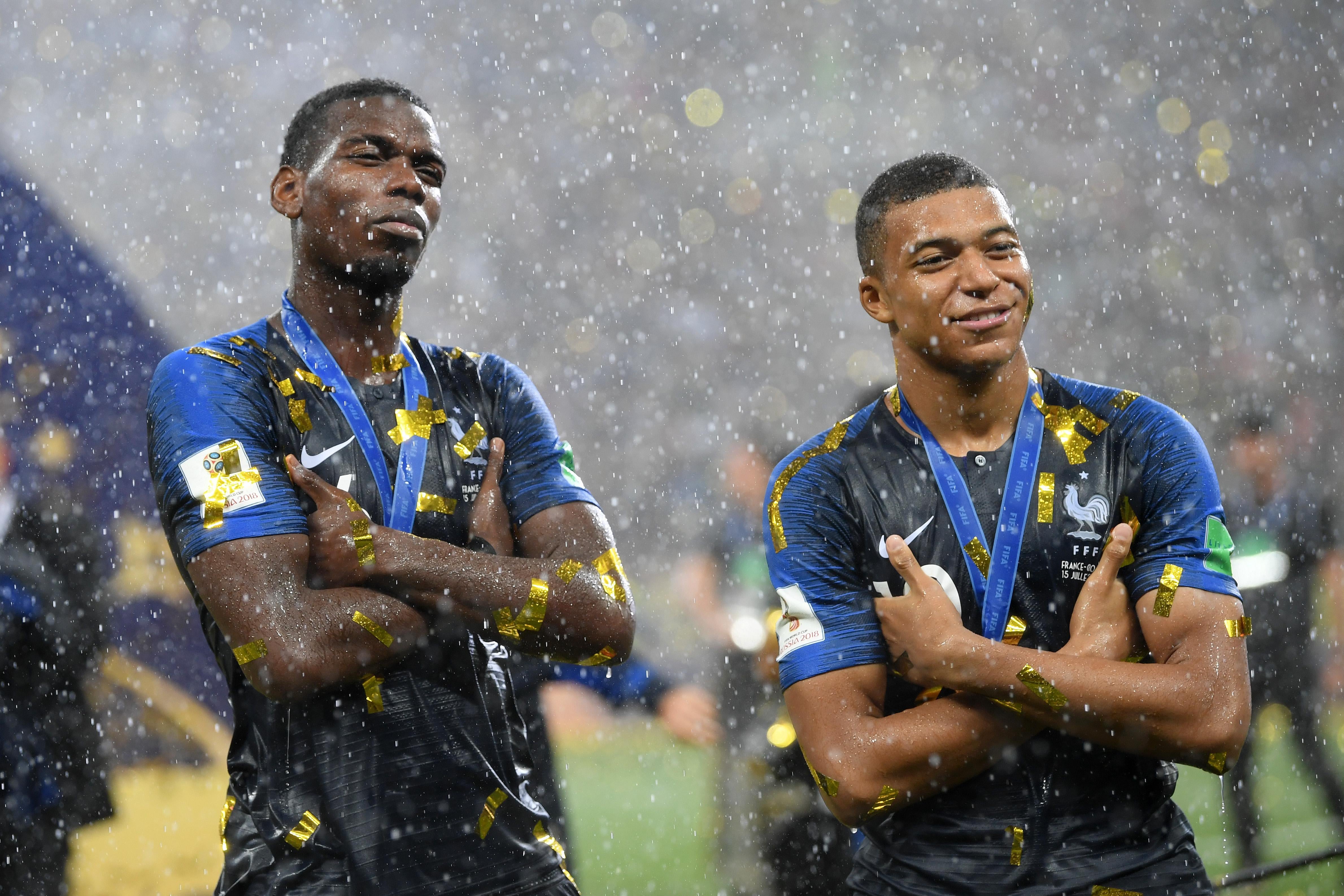 Paul Pogba and Kylian Mbappe of France celebrate victory.