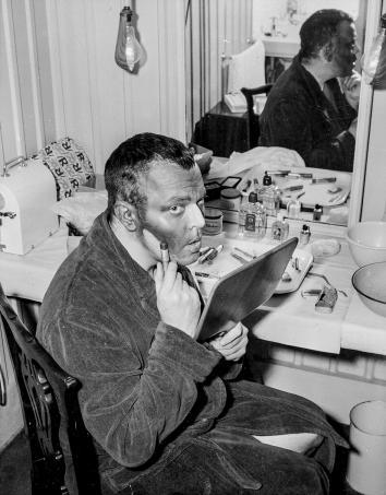American actor Orson Welles paints his face black for the role o