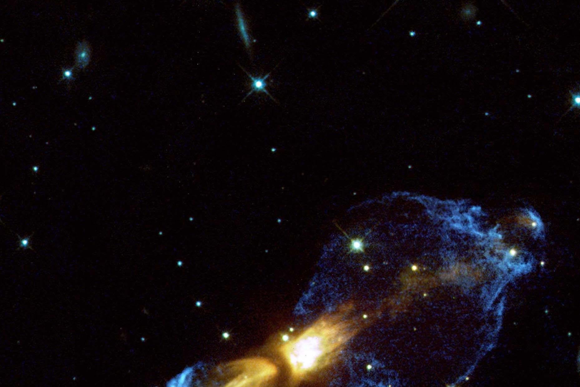 A telescope image with a large blue-yellow nebula and the center and various stars surrounding it.