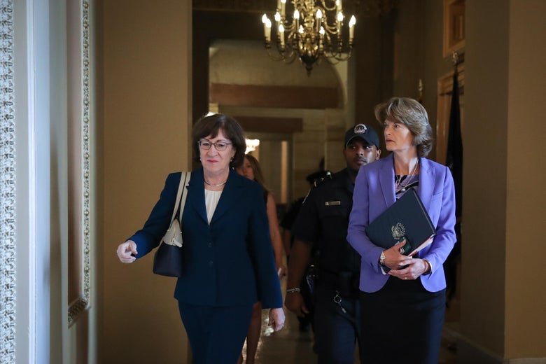 Collins and Murkowski walking together through the halls of Congress.