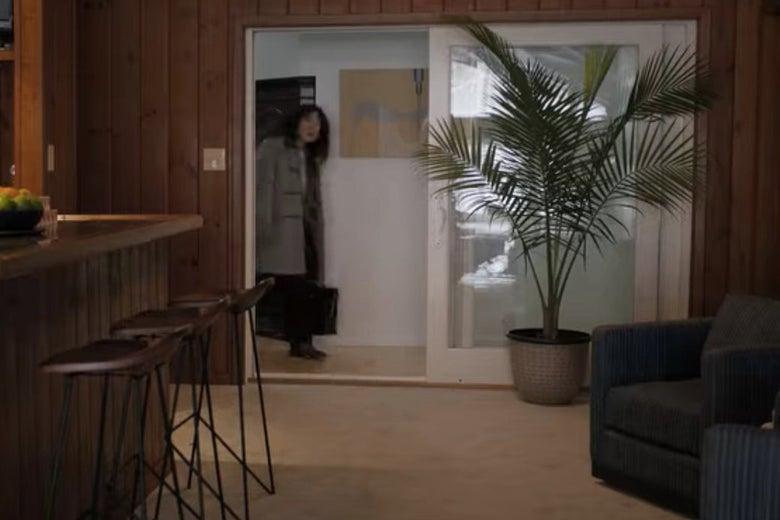 Dr. Kim walks into David Duchovny's pool area on The Chair.