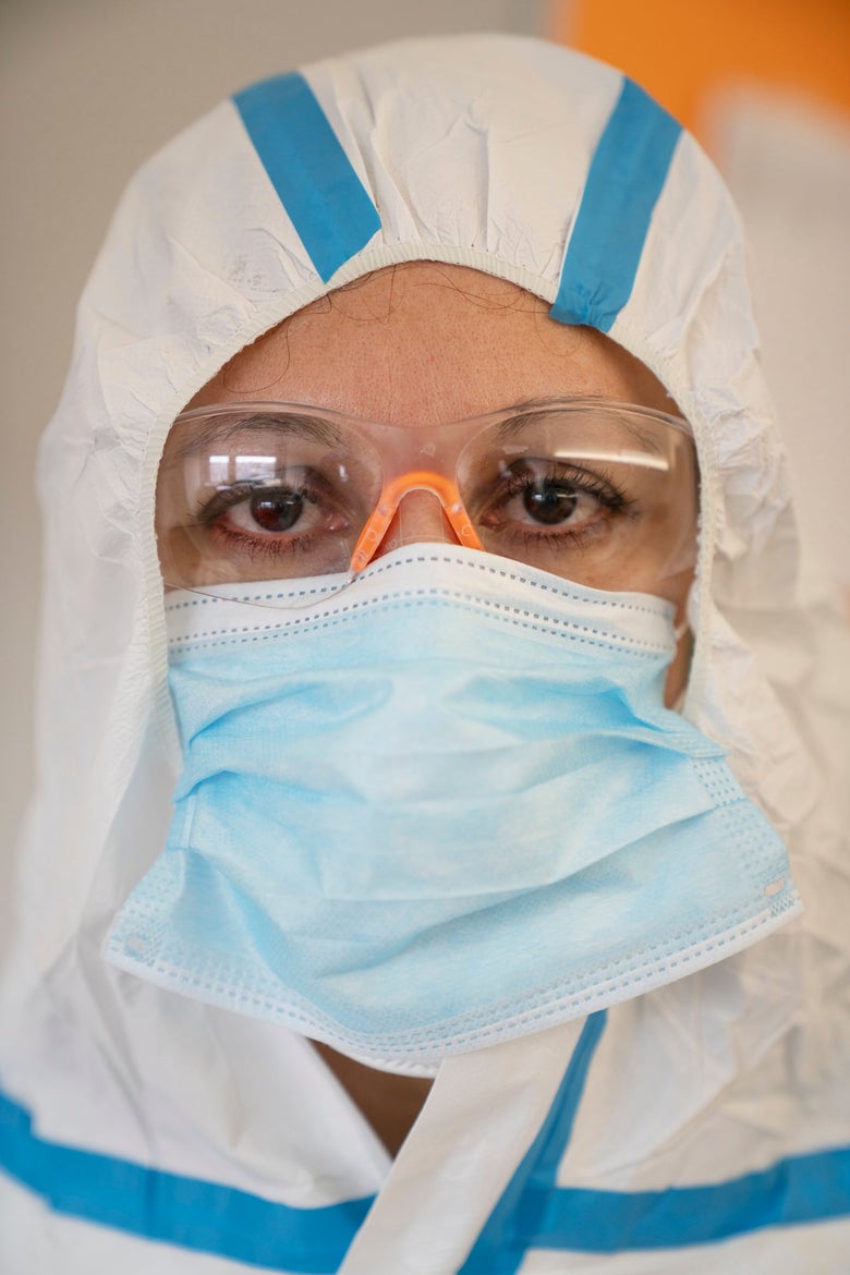 A doctor wearing personal protective gear.