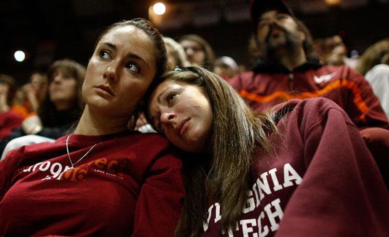 Virginia Tech students comfort one another during a convocation ceremony at Cassell Coliseum a day after a gunman shot and killed 32 people before turning the gun on himself April 17, 2007 in Blacksburg, Viriginia. 