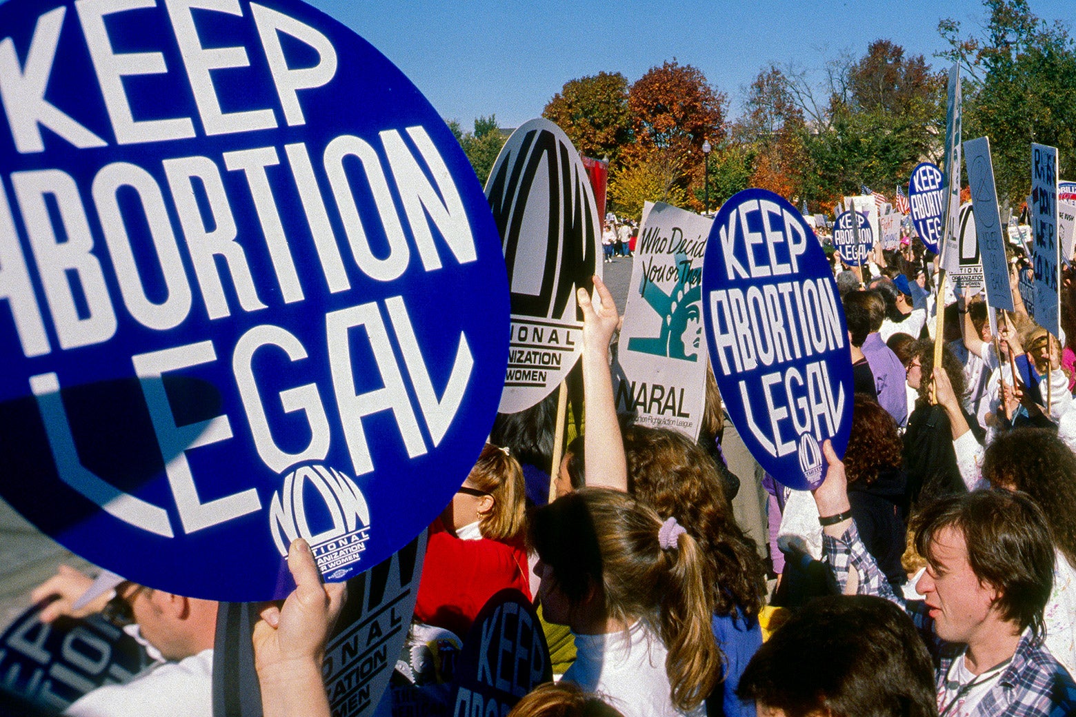 Protesters hold "Keep abortion legal" signs.