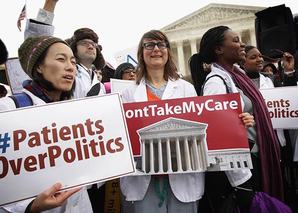 Supporters of the Affordable Care Act gather in front of the U.S Supreme Court during a rally.