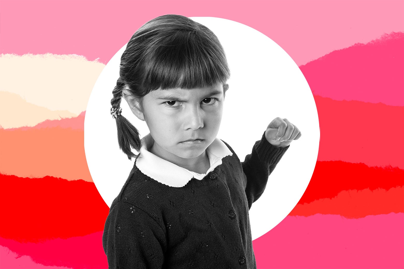 A young girl looking mad, pulling her arm back for a punch.