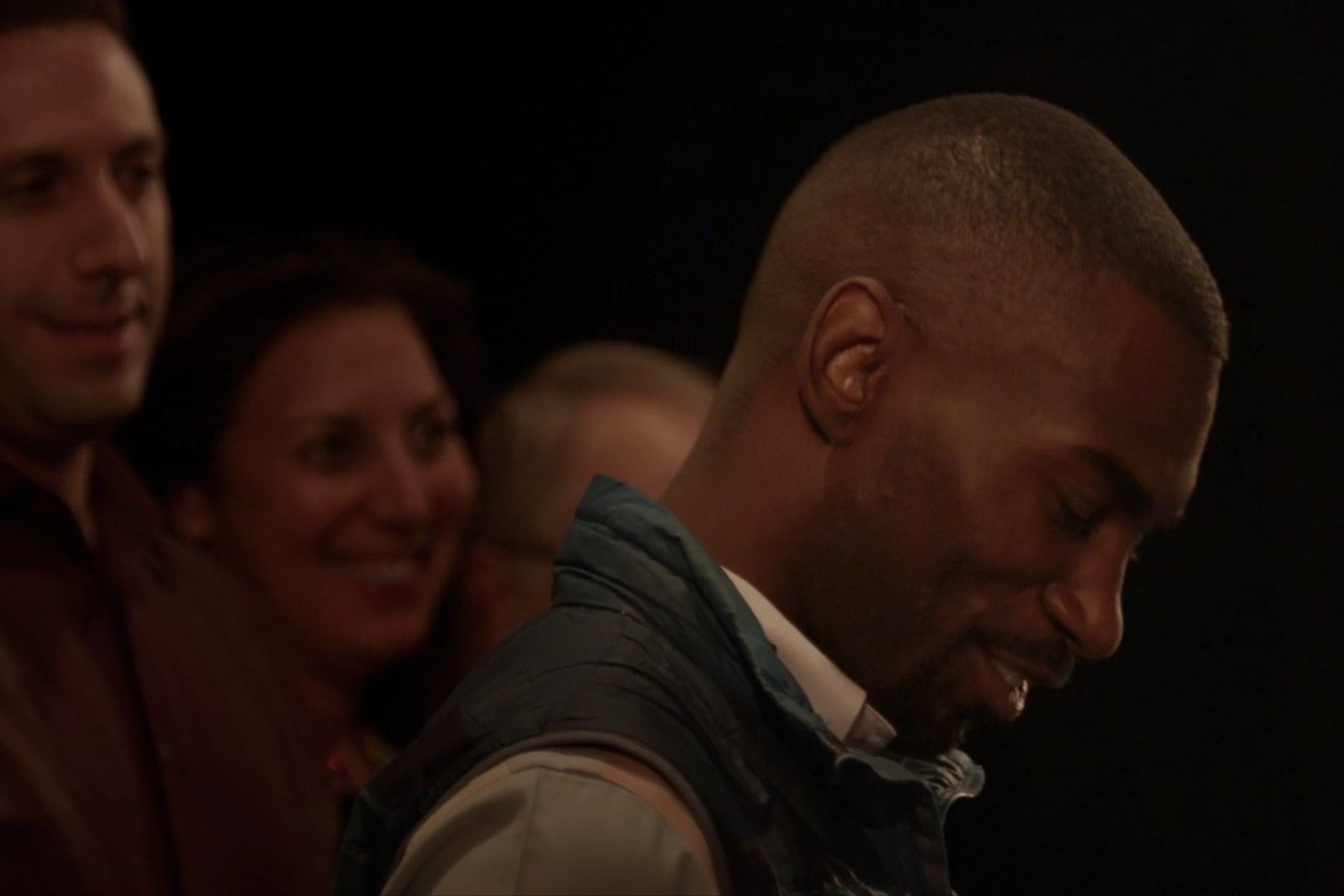 DeRay Mckesson, in a blue vest.