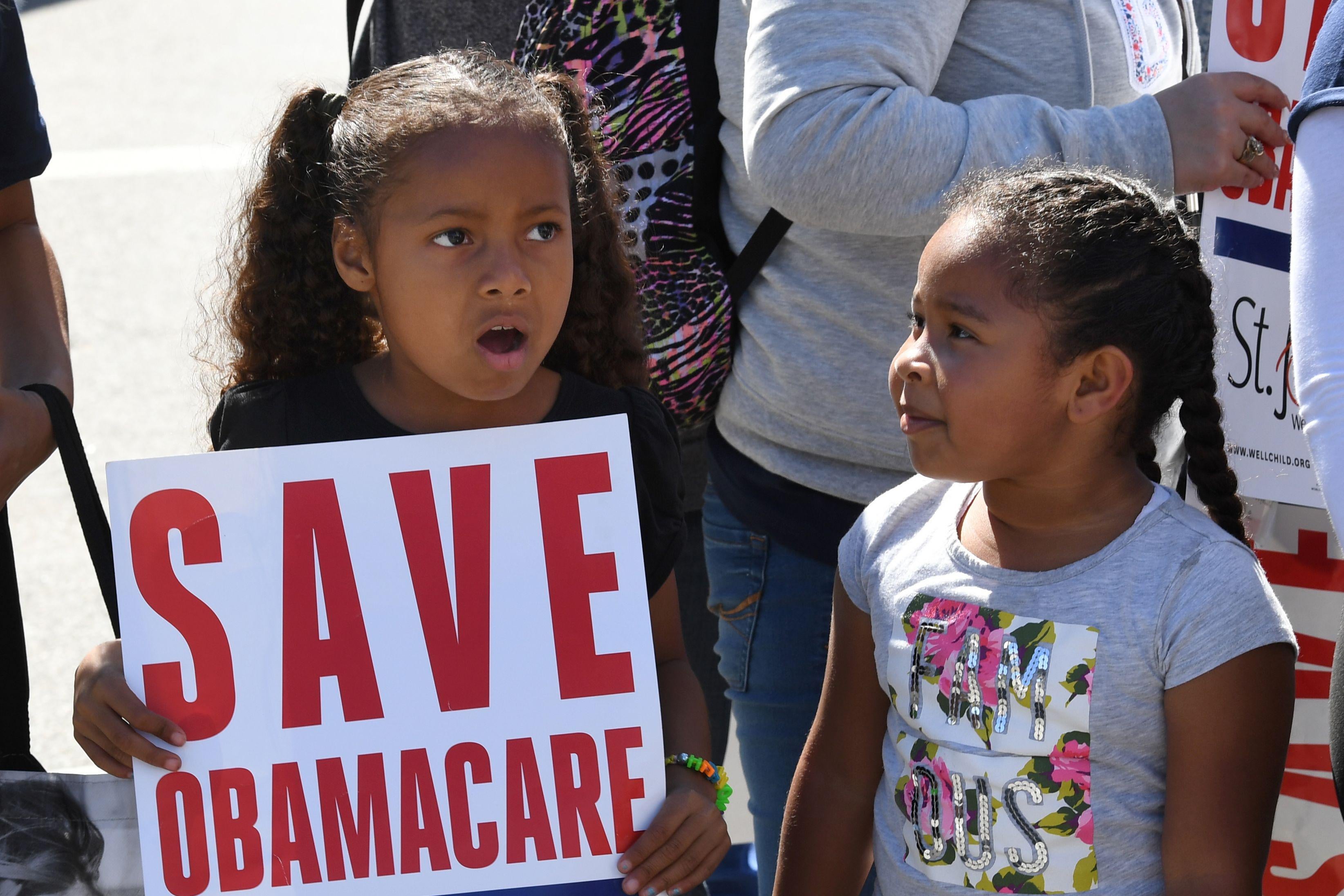 Young protesters march toward the Federal Building during a “Save the Affordable Care Act” rally in Los Angeles.