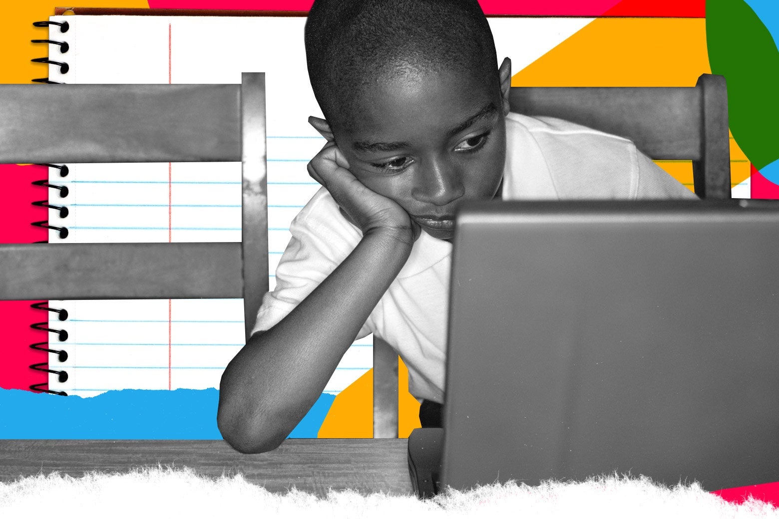 A Black boy rests his head on his hand as he stares at a laptop.