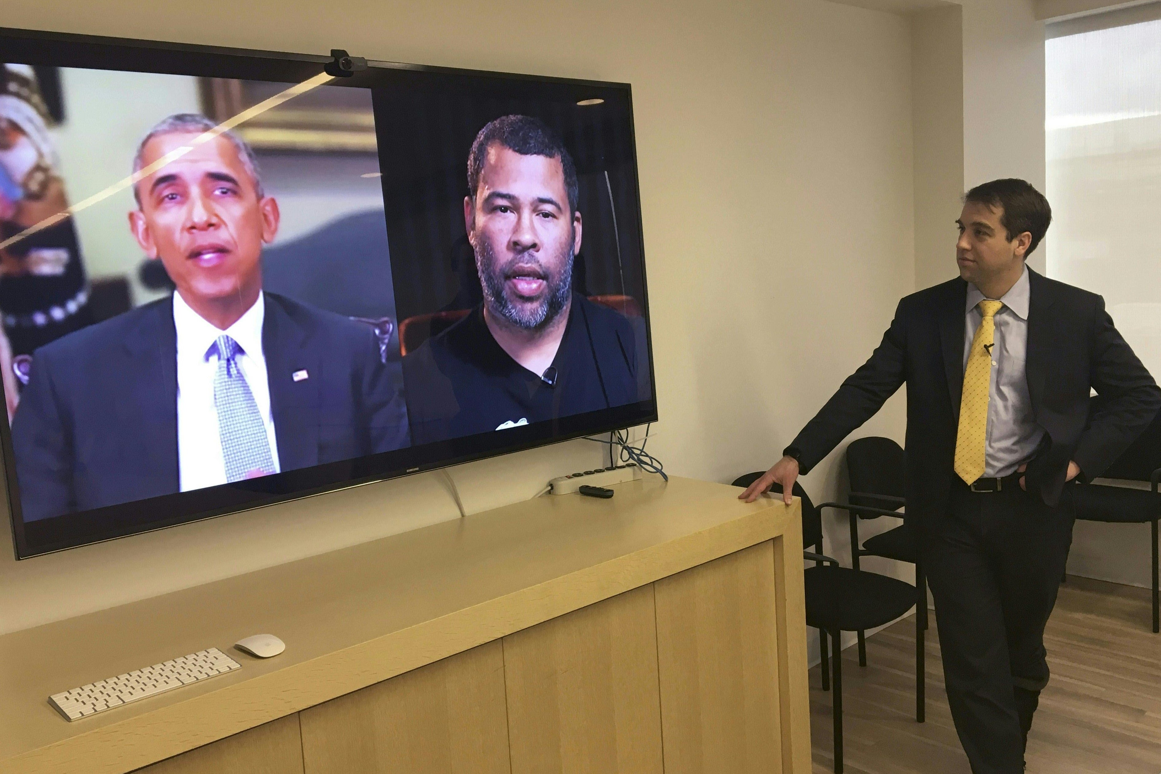 Vice President and Director of Studies at the Center for a New American Security Paul Scharre views in his offices a deepfake video of Barack Obama, created by filmmaker Jordan Peele.