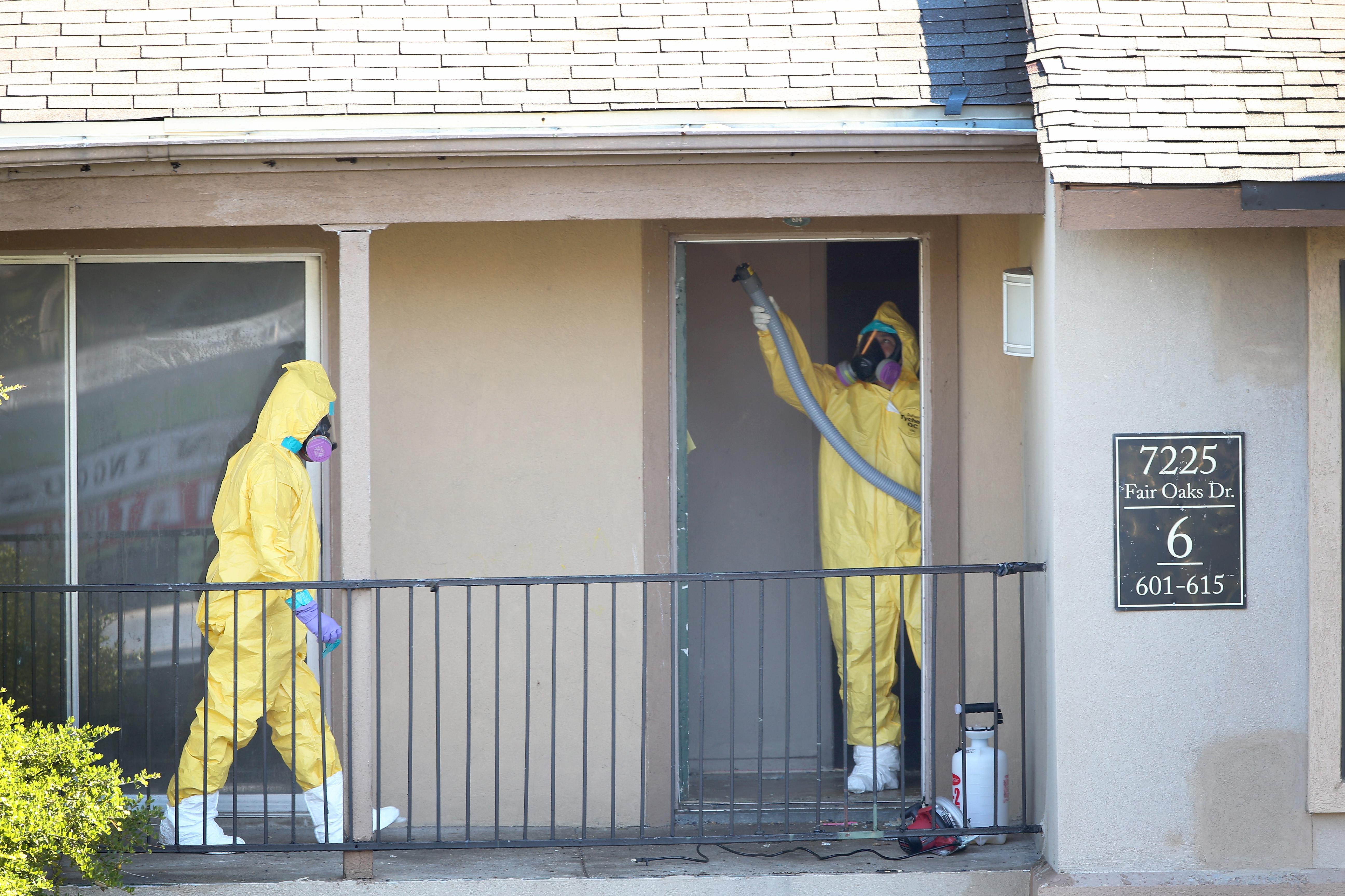 A cleaning crew sanitizes the apartment where Ebola patient Thomas Eric Duncan was staying before being admitted to a hospital on Oct. 6, 2014, in Dallas