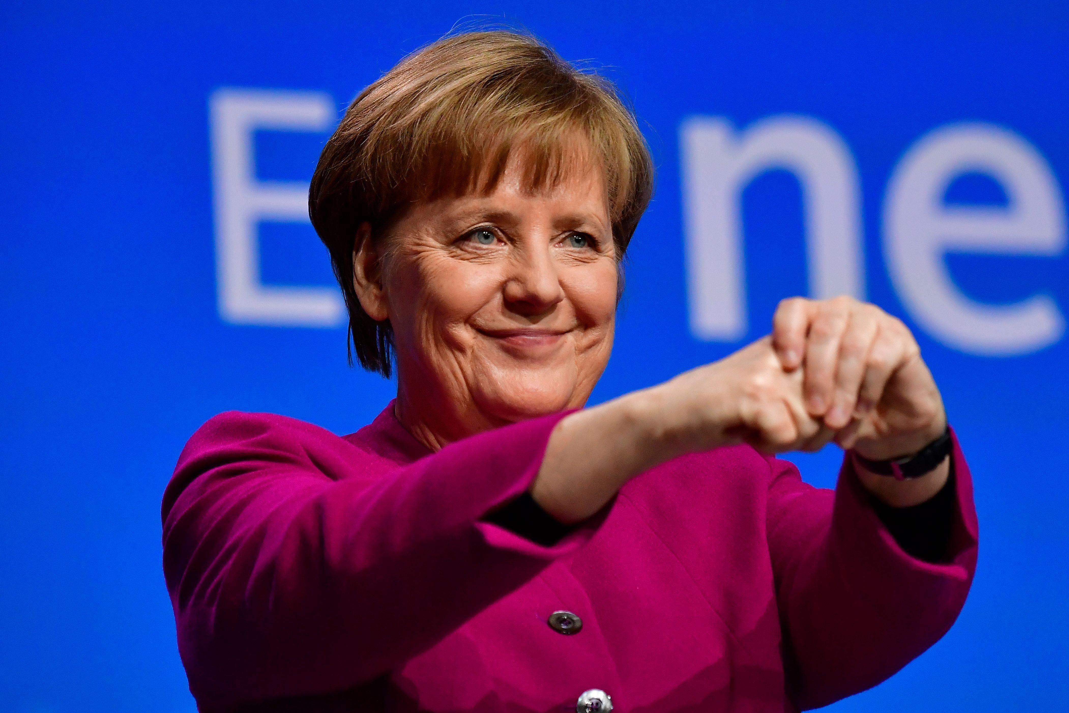 German Chancellor and leader of the conservative Christian Democratic Union (CDU) party Angela Merkel thanks delegates after giving a speech during the CDU's party congress on February 26, 2018 in Berlin.The CDU party of German Chancellor Angela Merkel is holding the congress to approve the coalition deal between the conservatives and the Social Democrats.